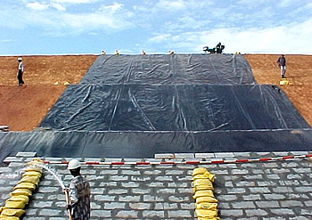 Image - Ash dyke pond, fly ash pond, disposal ash pon, bottom type ash pond, ash dyke waste management, solid waste management, ldpe liner for ash dyke, hdpe liners for ash dyke pond - climax, India