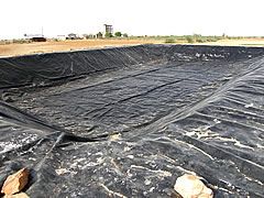 Solar evaporation pond used to reduce seepage losses, soil pollutions, water pollutions, hdpe geomembrane liners protect soil & ground water beneath, Climax,India - Image